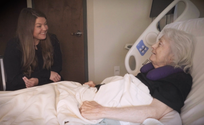 Nurse visiting with patient