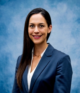 Headshot of Becky in blue blazer and white blouse